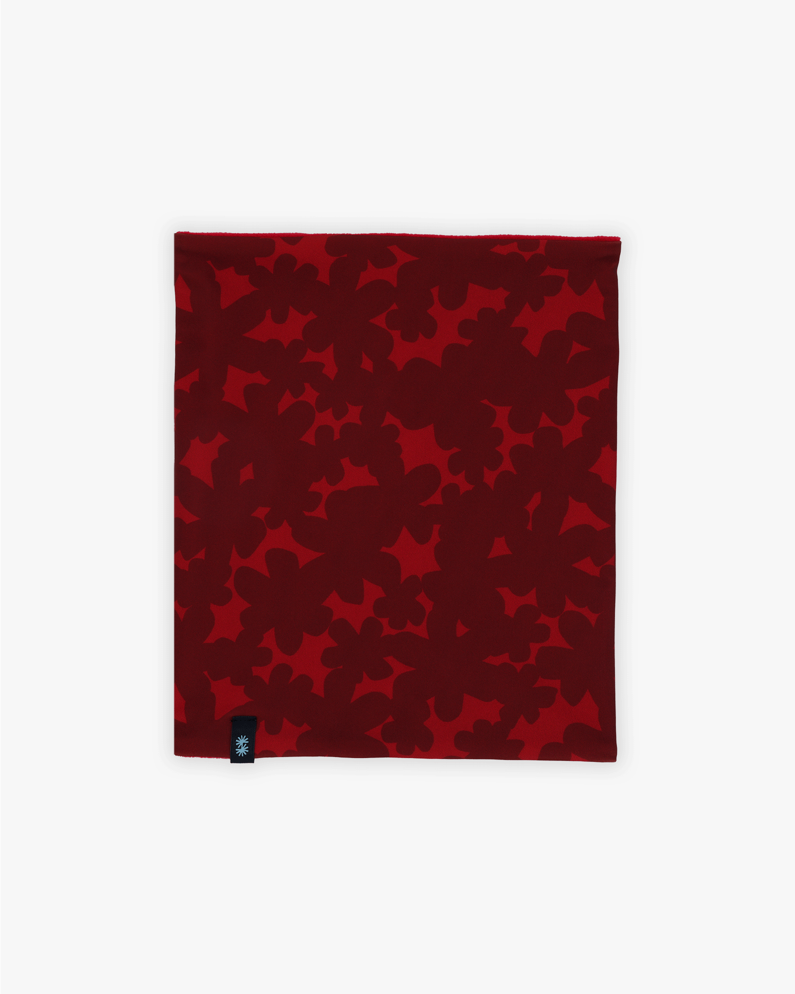 Front view of a double layer neck warmer with red floral printed lycra, red fleece lining and black CTW logo woven label