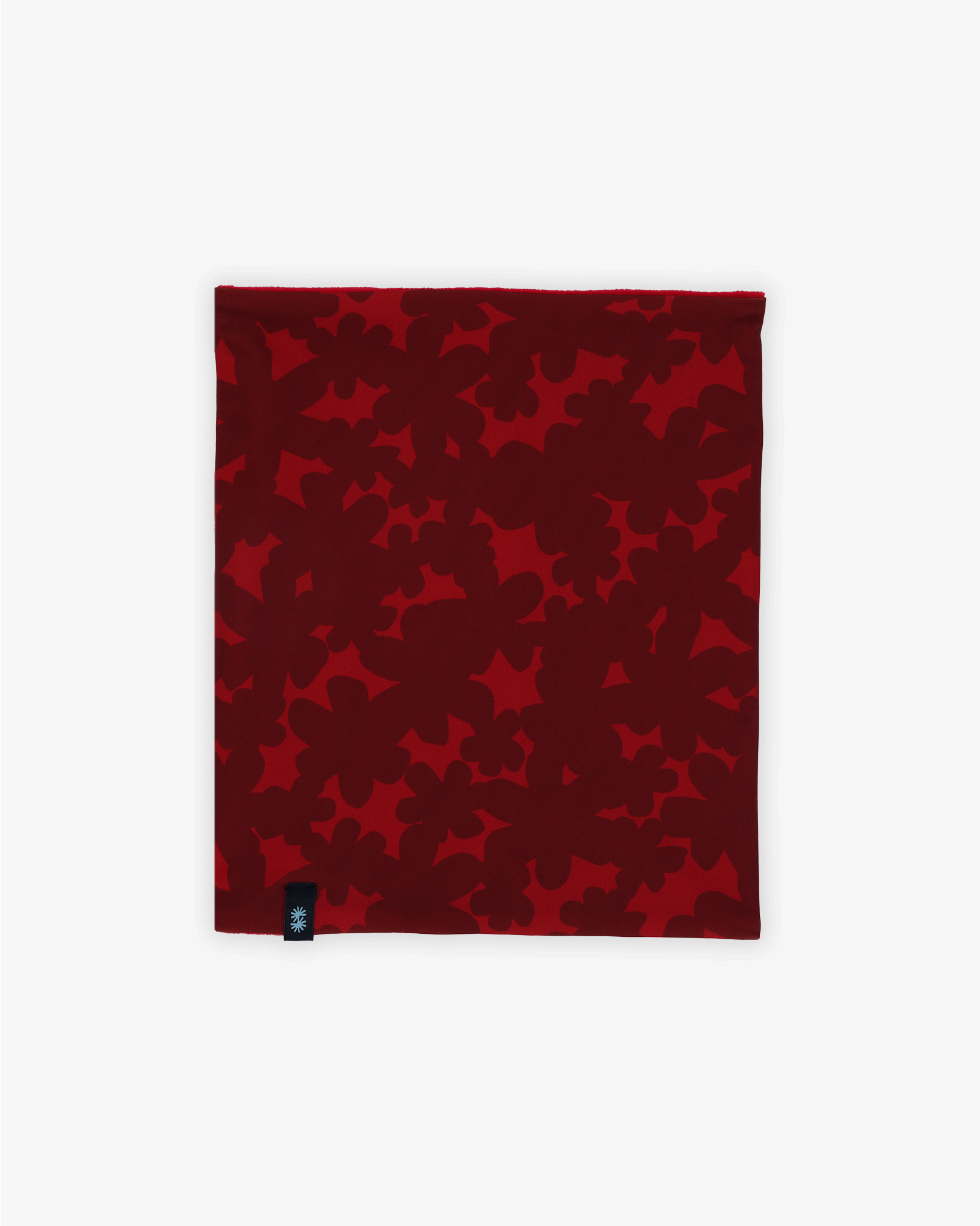 Front view of a double layer neck warmer with red floral printed lycra, red fleece lining and black CTW logo woven label