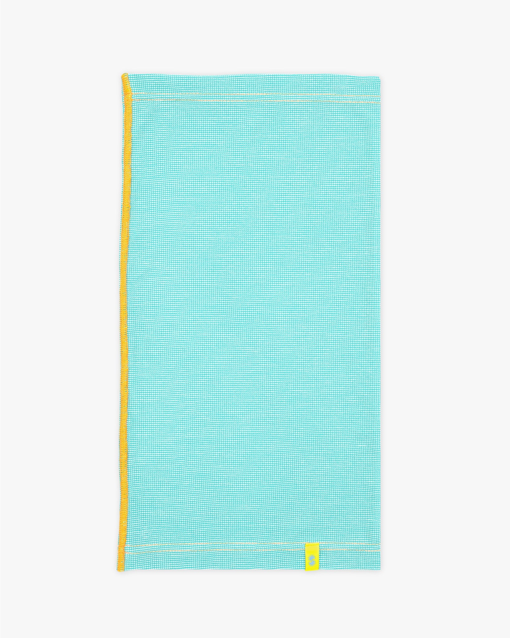 Side view of a long aqua blue Power Wool neck gaiter, with an orange back seam and yellow CTW logo woven label