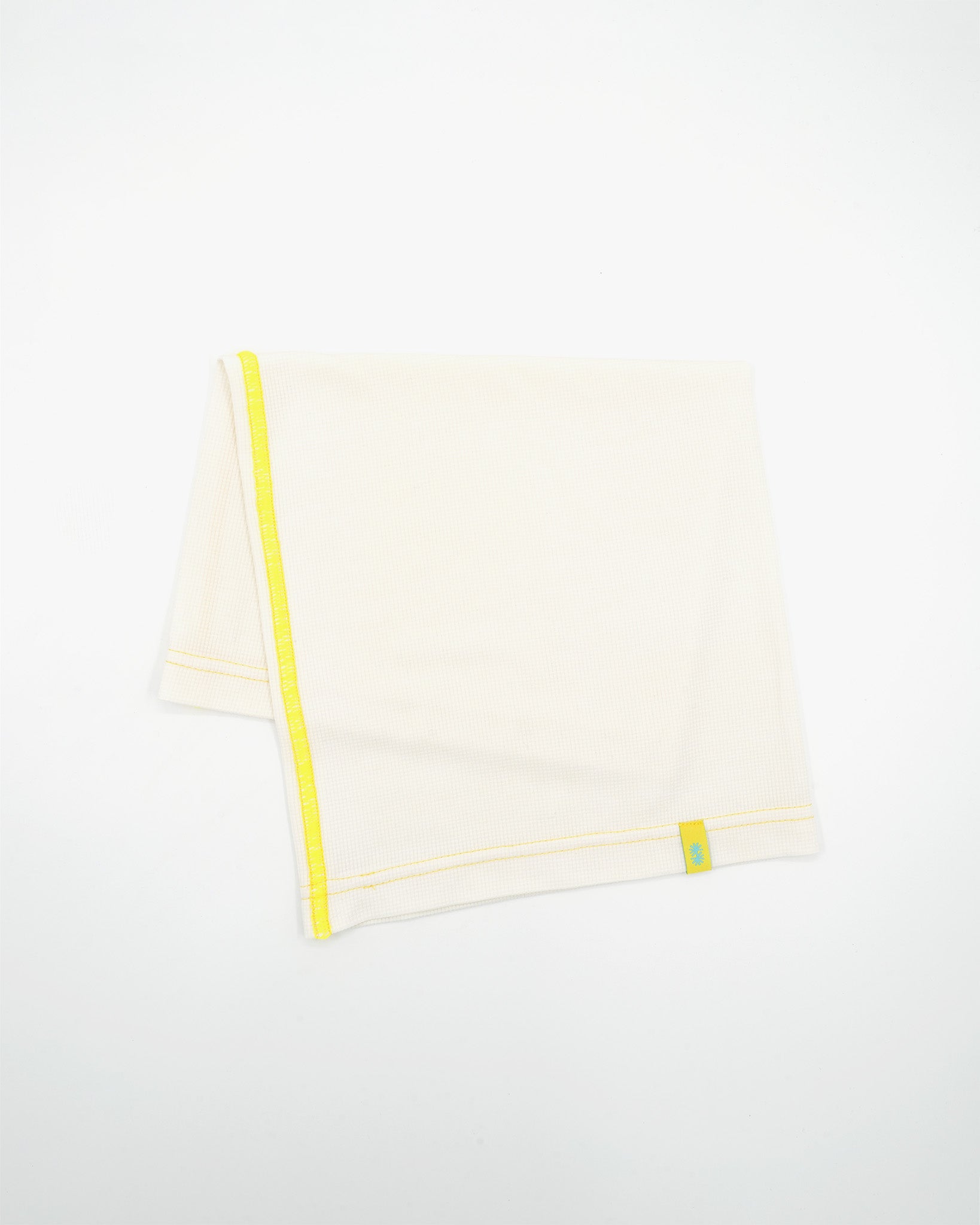 Folded view of a long off-white Power Wool neck gaiter, with a yellow back seam and yellow CTW logo woven label