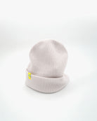 Off-white cashmere merino wool beanie with yellow woven label