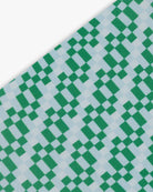 Goggle cover with green, gray and white checkered print close-up