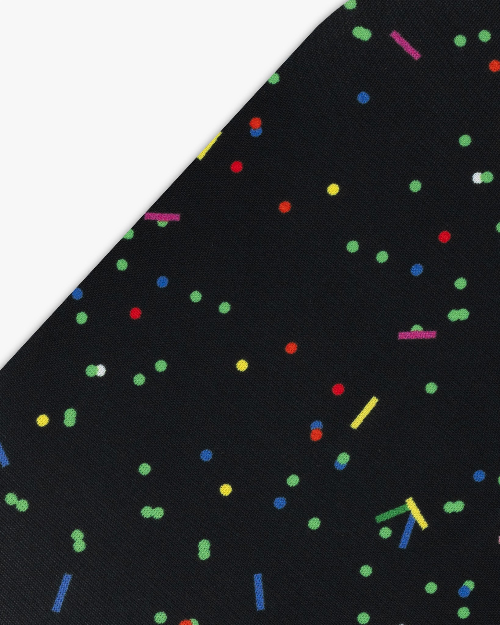 Goggle cover with colorful confetti on black background geometric print close-up