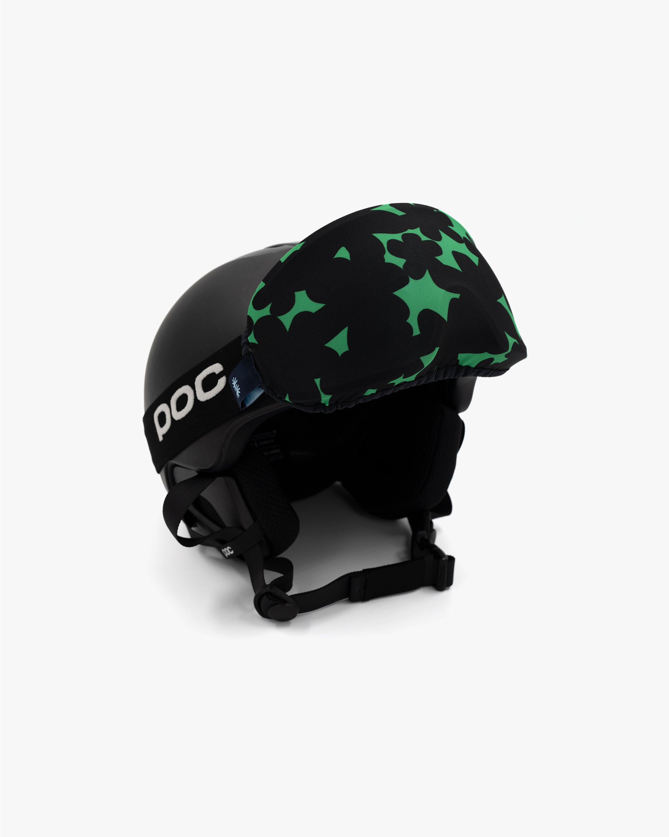 Helmet with goggles covered with a goggle cover with green and black floral print