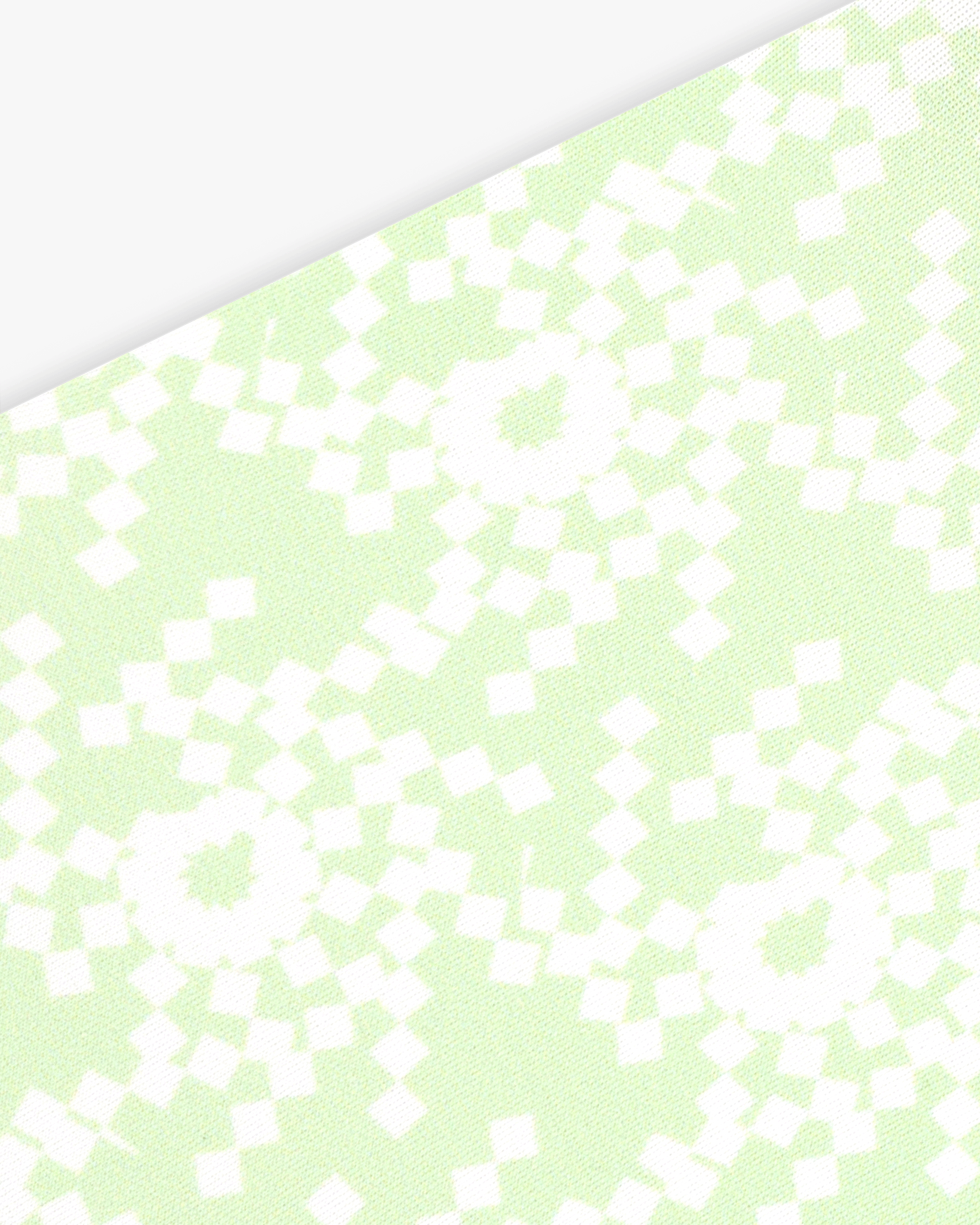 Goggle cover with green and white geometric snowflake print close-up