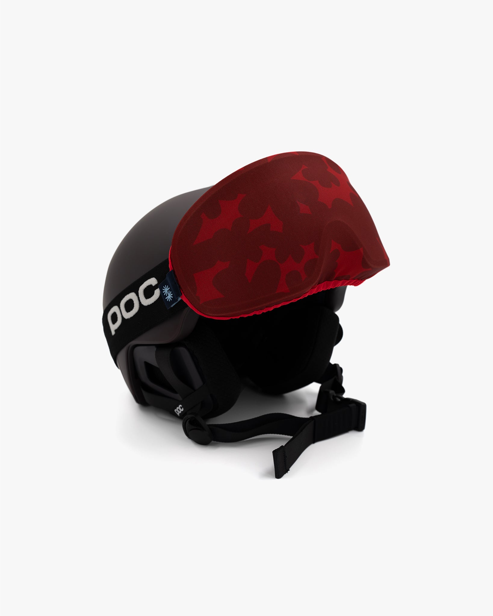 Helmet with goggles covered with a goggle cover with red floral print