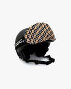 Helmet with goggles covered with a goggle cover with black, orange and beige checkered print