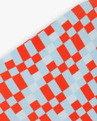 Goggle cover with red, gray and white checkered print close-up