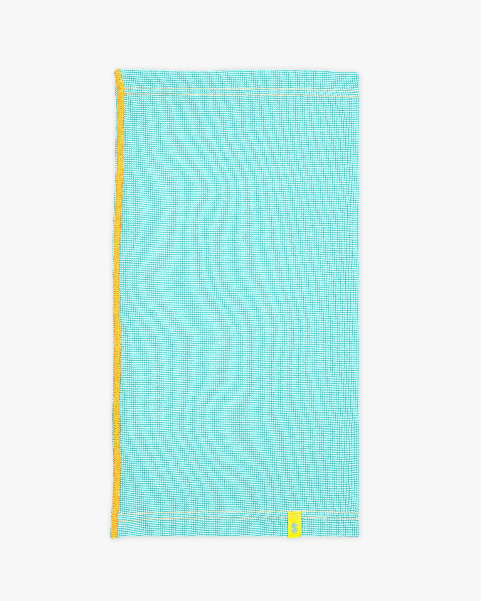 Side view of a long aqua blue Power Wool neck gaiter, with an orange back seam and yellow CTW logo woven label