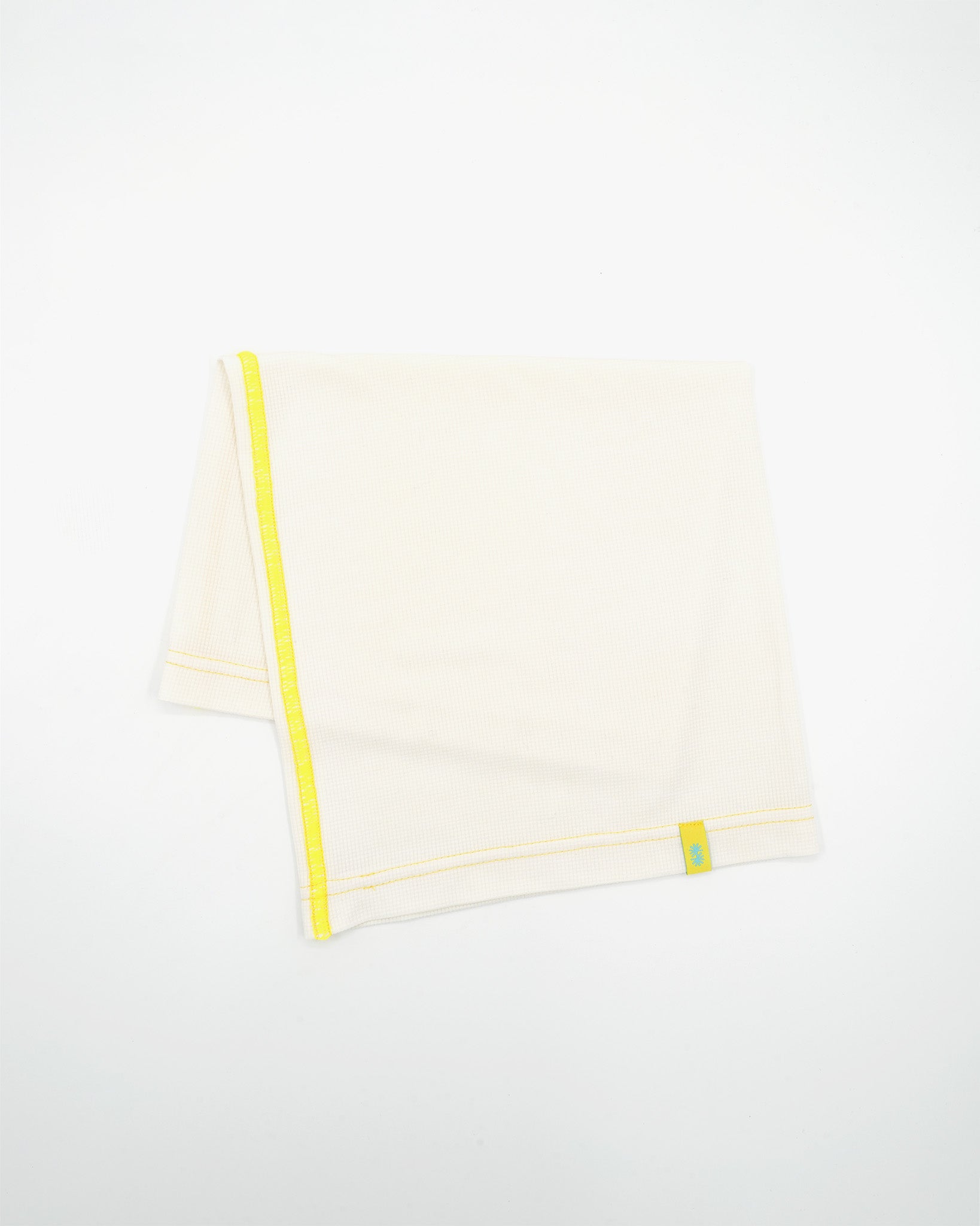 Folded view of a long off-white Power Wool neck gaiter, with a yellow back seam and yellow CTW logo woven label