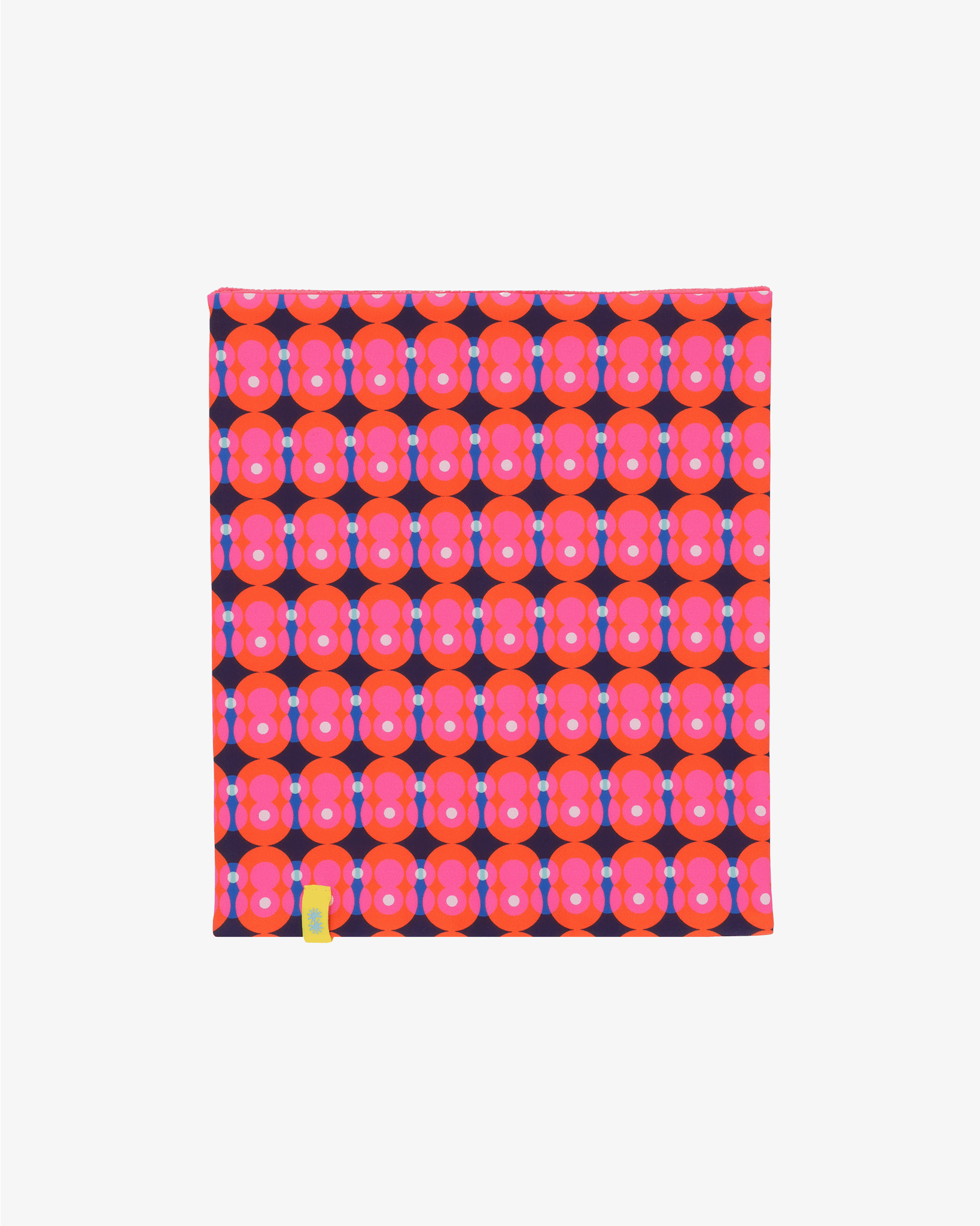 Front view of a double layer neck warmer with a bright pink and red circles on dark blue background geometric printed lycra, pink fleece lining and yellow CTW logo woven label